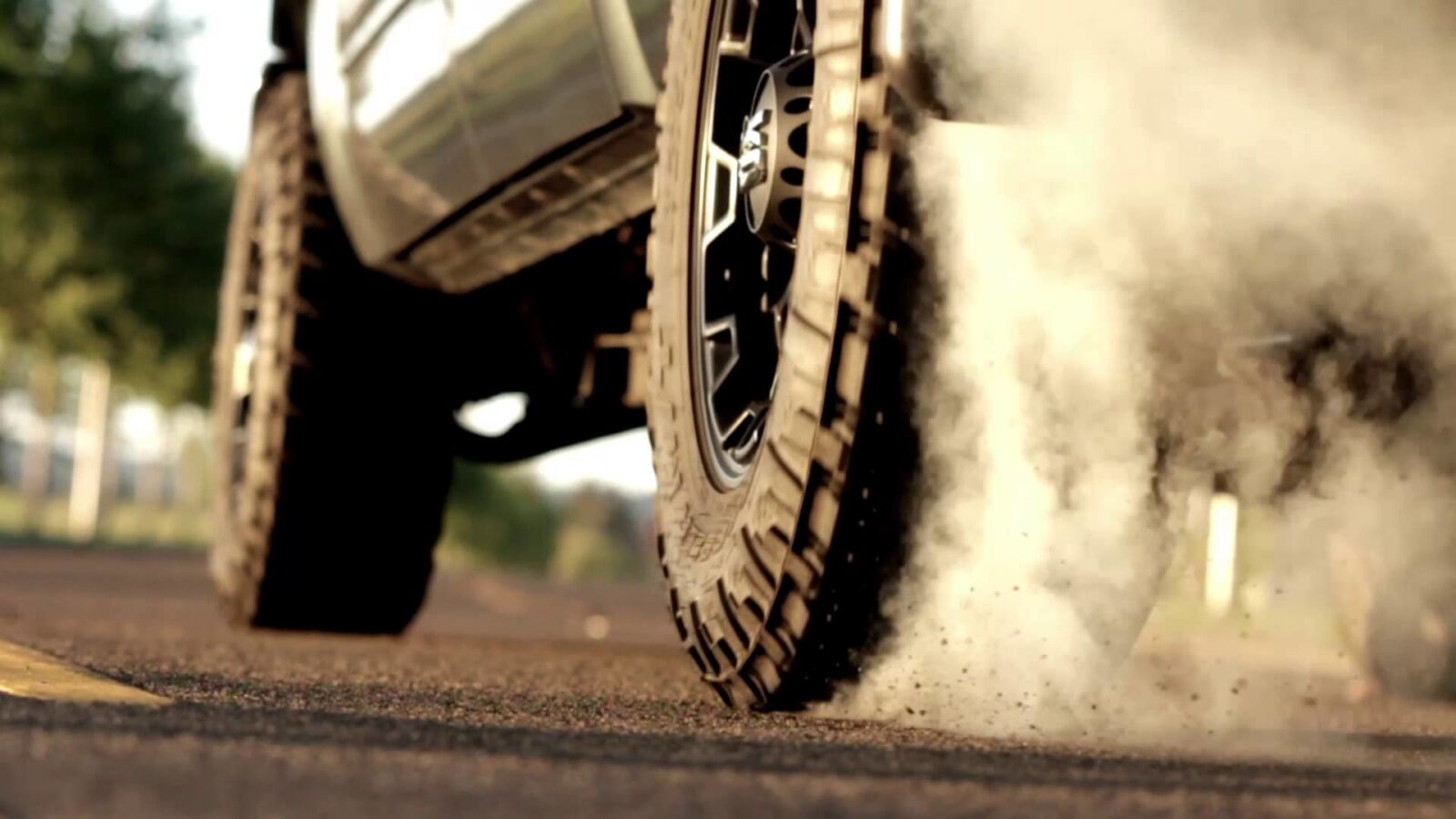 Off-road tire kicking up dust