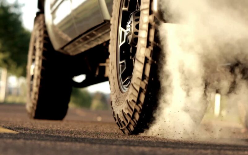 Off-road tire kicking up dust